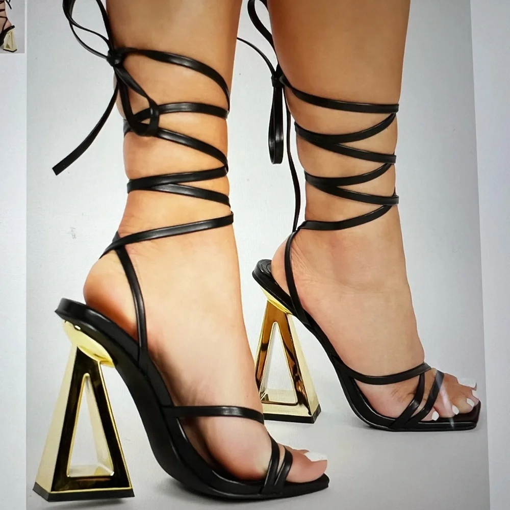 FASHION NOVA STAY WINNING WRAP UP HEELS ‎ IN BLACK GOLD NOVELTY HEELS
